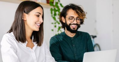 man and woman on laptop