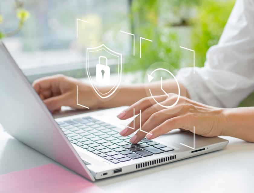 Woman typing on laptop